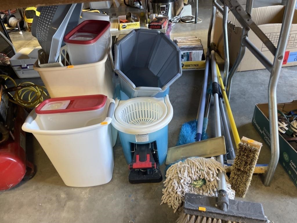 Trash can , mop bucket and cleaning items