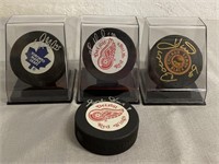4 Signed NHL Hockey Pucks