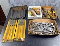 Assortment of tools including wrenches, files,