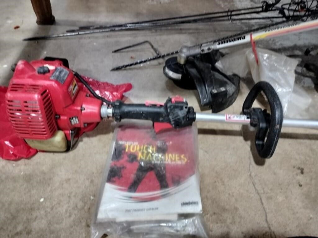 Shindaiwa gas powered tree trimmer with four
