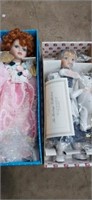 2 porcelain dolls, 1 heritage collection, and 1