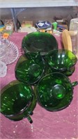 Green glass cup and saucer