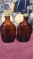 2 brown glass bottles 8in tall