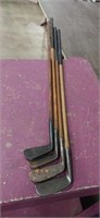 Lot with 4 vintage wooden handle golf clubs