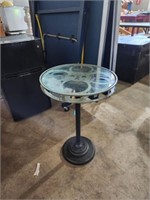 Movie reel pedestal table 30x18 glass top