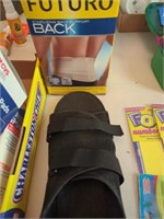 Futuro back support wrap and an orthopedic shoe