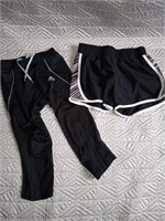 C9) Xs tek gear shorts and small Adidas capris.