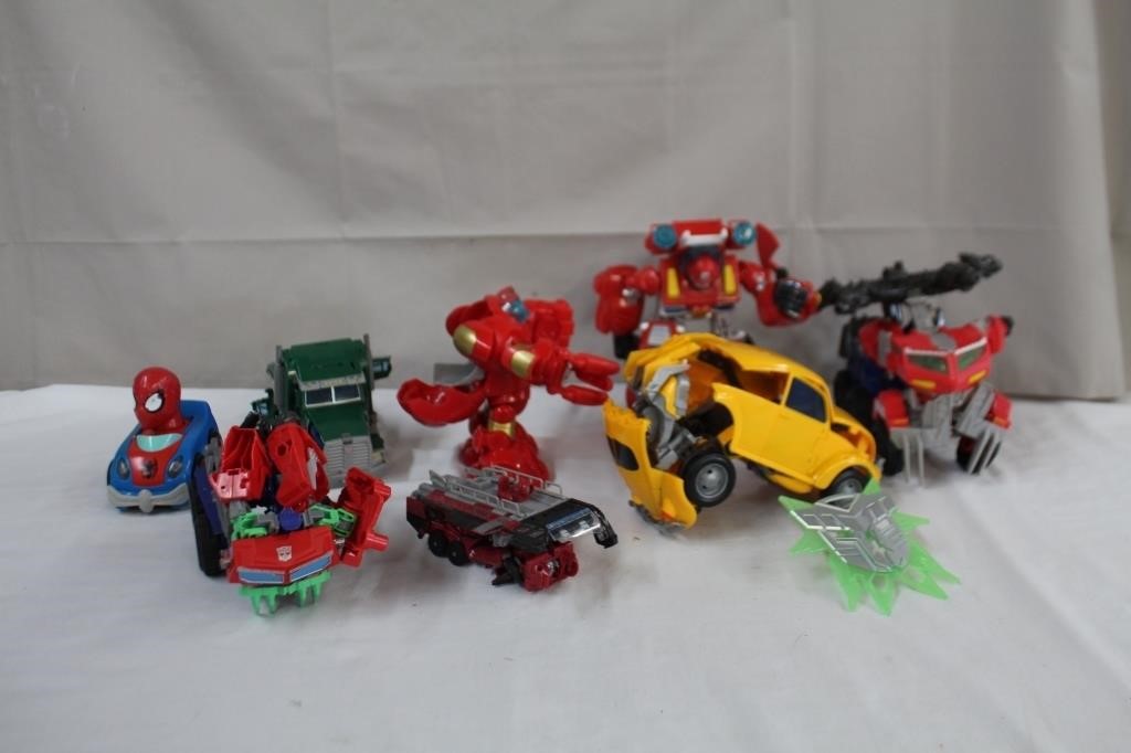 Seven transformer vehicles & spiderman car