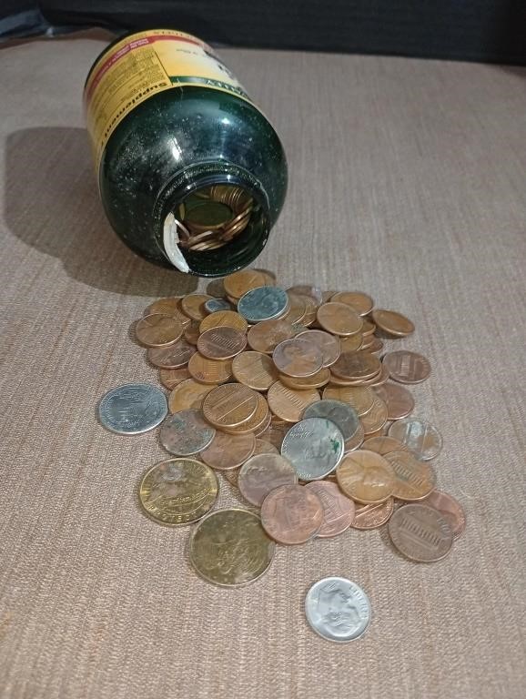 Jar of pocket change. It's mostly pre 1985