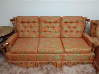 Lively floral print vintage couch. Matching chair