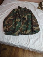 Cold weather camouflage field coat size Med. Good
