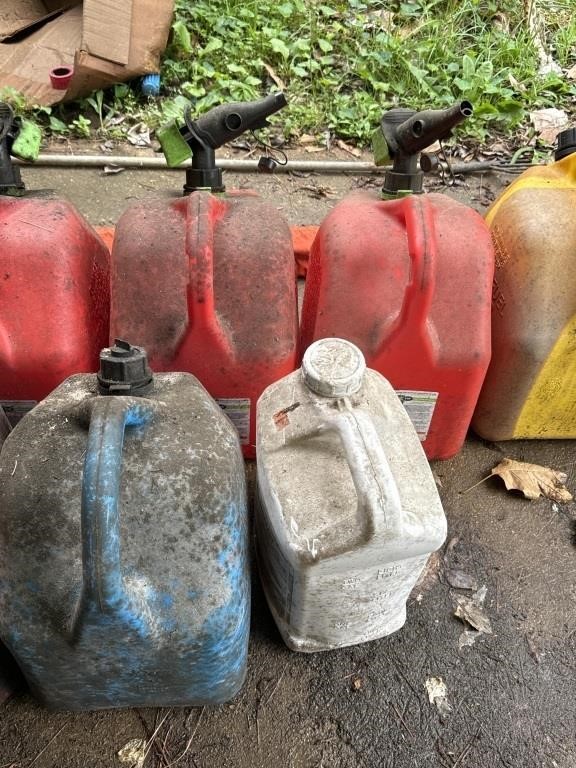 3 gas cans and contents