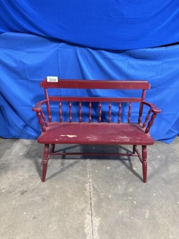 Vintage red wooden bench, approximately 44” long.