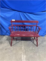 Vintage red wooden bench, approximately 44” long.