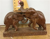 Carved wood elephants fighting