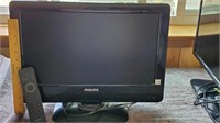 Philips flat-screen TV with remote