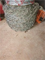 Large roll of barbed wire15.5 gauge