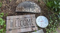 DOOR MATS AND AN OUTDOOR THERMOMETER