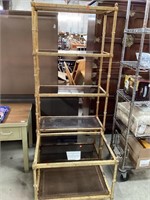 Metal and glass shelving unit with matching table