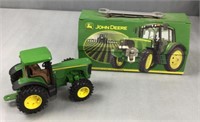 John Deere Child, tin toolbox and plastic tractor