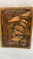 Hammered copper ship on board