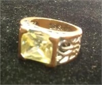 YELLOW STONE RING WITH WRITING ON THE INSIDE