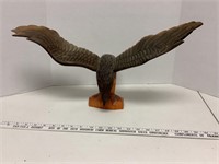 wood carved eagle wing is chipped