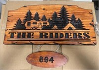 Wooden sign With # The Riders