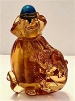 Amber Colored Peking Glass Snuff Bottle LION Motif