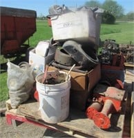 Assortment of Case garden tractor parts on