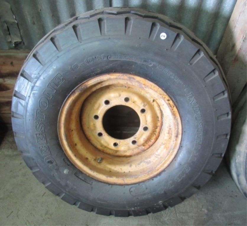 Deestone 11L-16 SL tire with 8 lug rim.