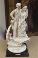 Armani figurine on stand