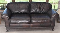 Brown Leather Couch with Rolled Arms and Carved