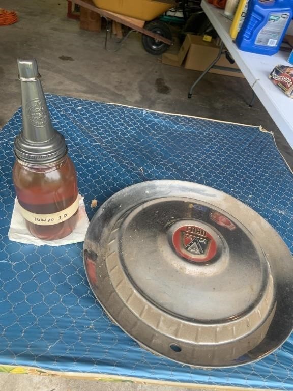 Antique Ford hubcap, glass oil jar