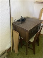 Sewing desk with chair, yardsticks metal rod