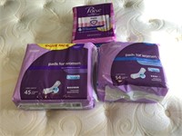 Three packages of bladder pads for women