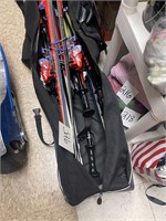 3 sets of skis and 2 sets of poles and bag