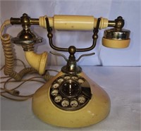 Vintage yellow French style rotary phone