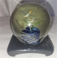 Decorative glass paperweight with stand