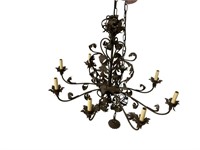 Cast metal eight light chandelier with long chain