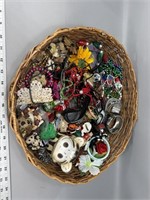 Large basket filled with jewelry brooches