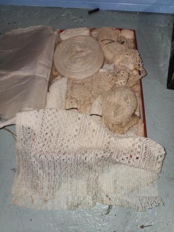 Box lot of doilies and ribbon