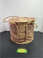 Woven Wicker Basket and Baby Clothes
