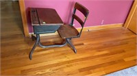 Vintage child’s school desk with iron bottom and