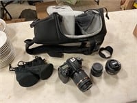 Nikon camera with bag and extra lens