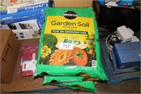 4- bags miracle-gro potting soil (1-damaged)