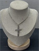 Silver toned cross necklace; costume jewelry