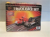 VINTAGE BATTERY OPERATED TRUCK RACE SET