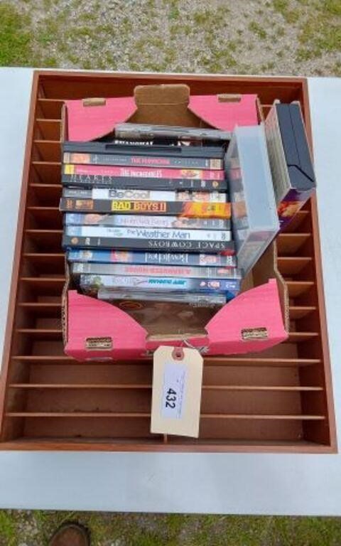 DVDS- VHS AND A WOODEN MOVIE HOLDER