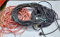 2 HEAVY BLACK EXTENSION CORDS AND ONE ORANGE